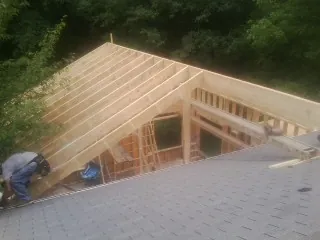 Framing a new roof addition that ties into an existing shingle roof in Vass